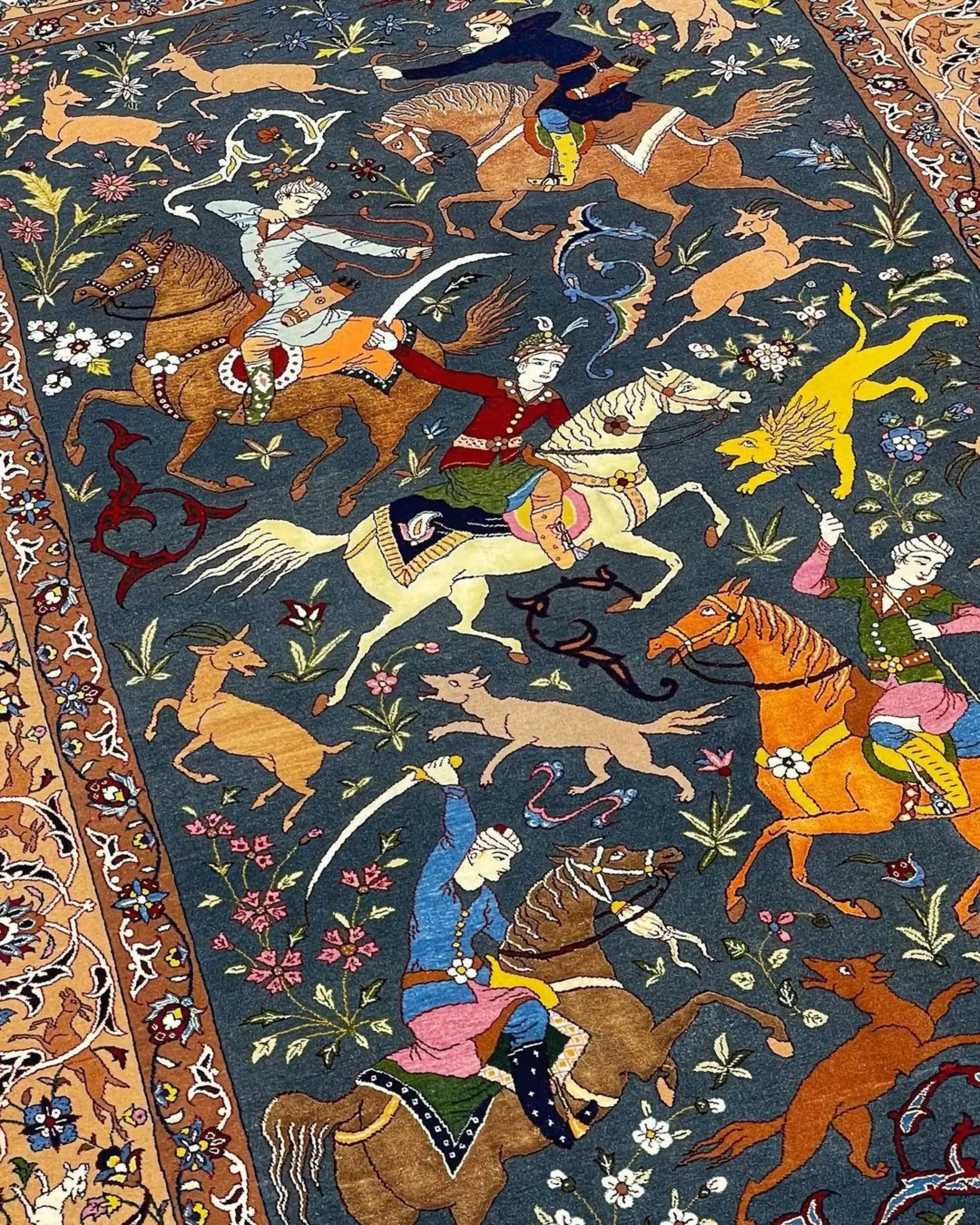 Handmade Persian rug with lifelike hunting designs and natural dyes.